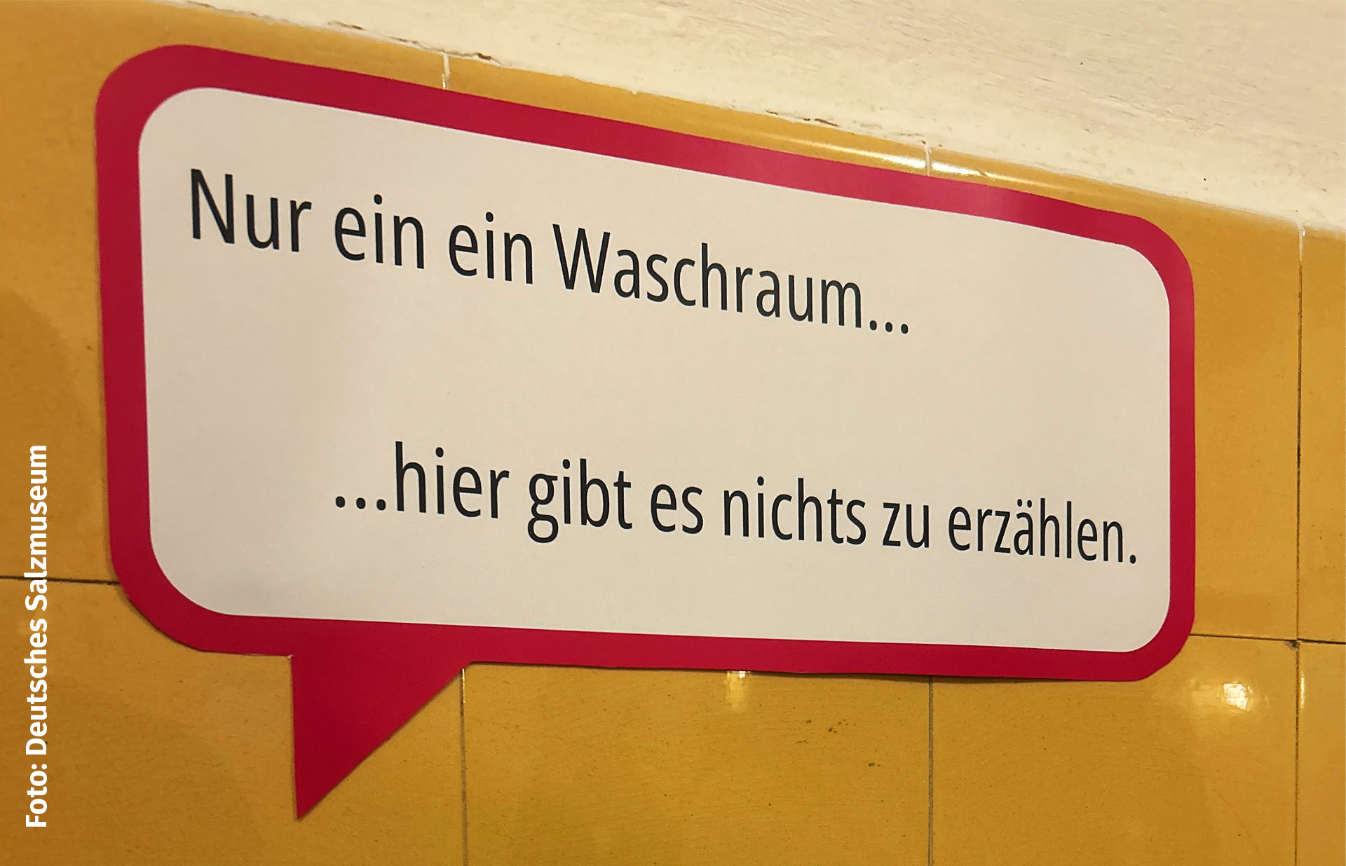 Sprechblase im Waschraum mit der Aufrschrift 